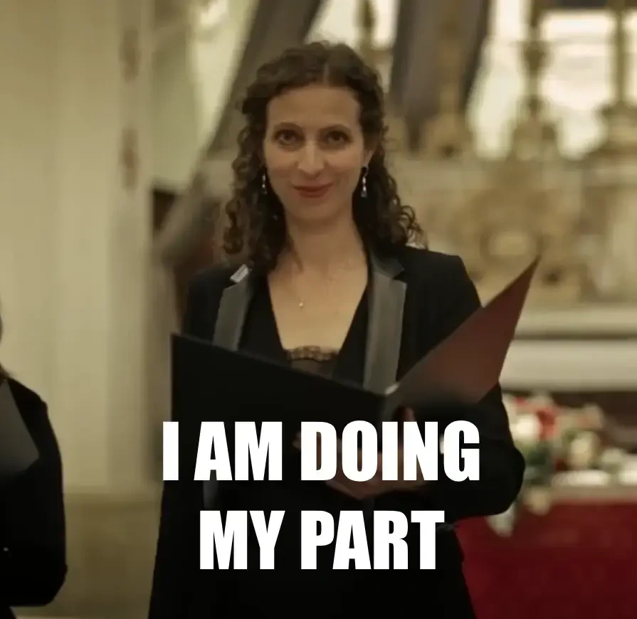 A woman singer holding her book with notes and smiling into the camera. Pasted over text reads: I'm doing my part.