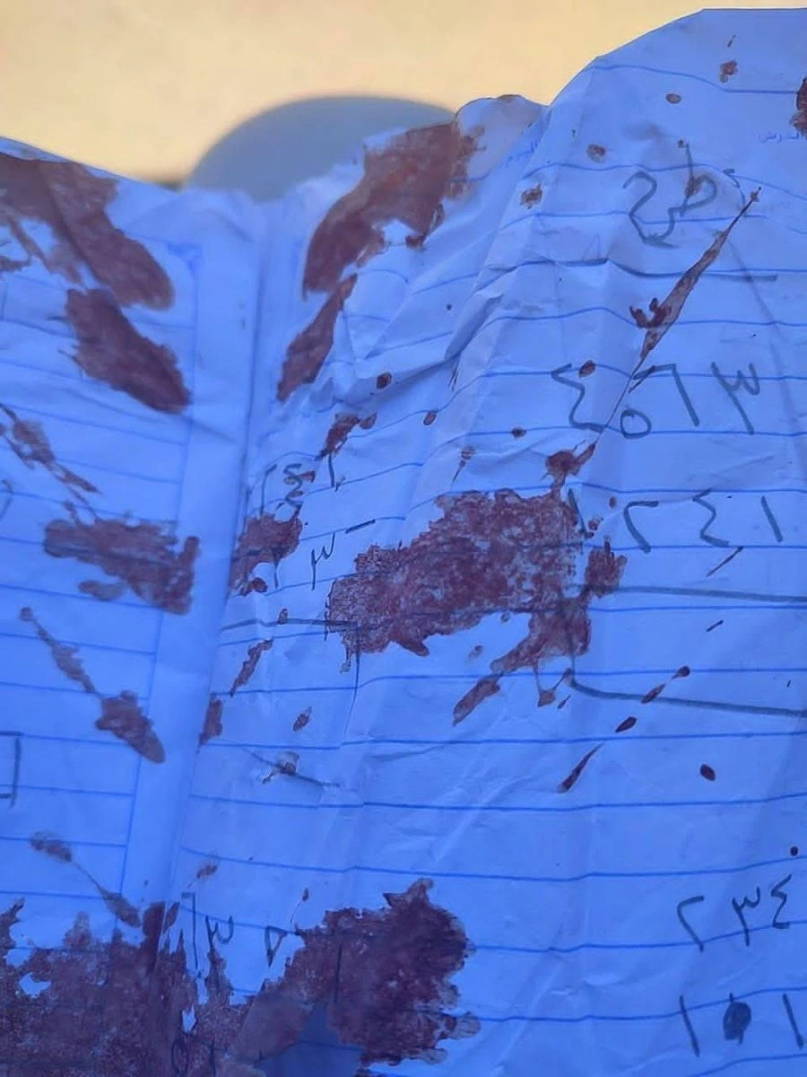 A paper of 9 years old girl(Ritaj) in Gaza stained with her blood as she was killed while studying math