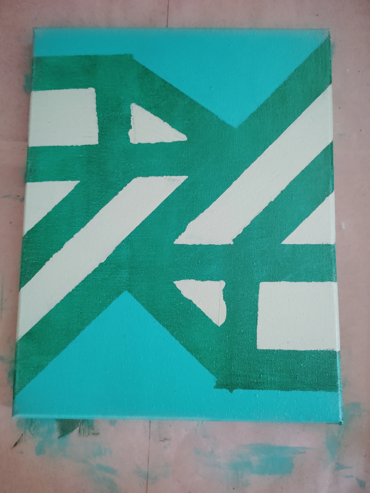 Acrylic paint on canvas. Sea green background with two green cut gem patterns.