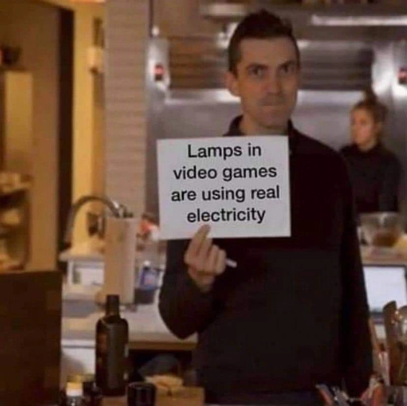 A man holding a sign that reads "lamps in video games are using real electricity" 