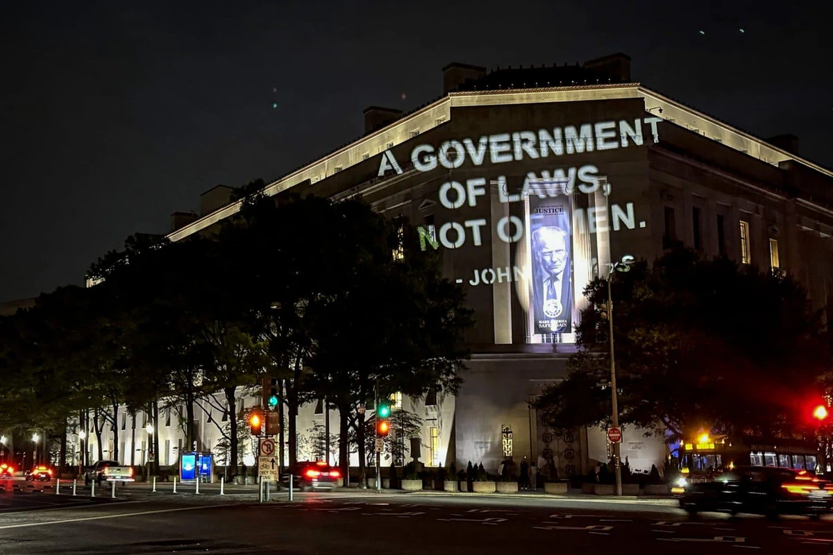 John Adams “A government of laws, not of men" quote on DOJ building in protest of $1.8B fund