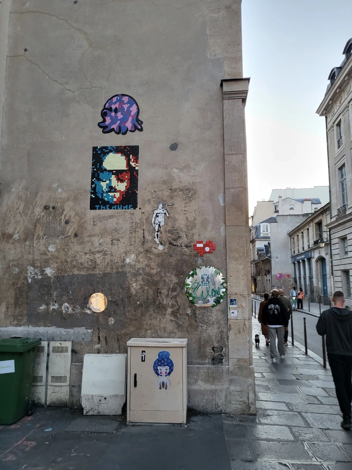 Graffiti of The Dude from the big lebowski movie, rendered with small red white and blue tiles in the style of Shepard Fairey