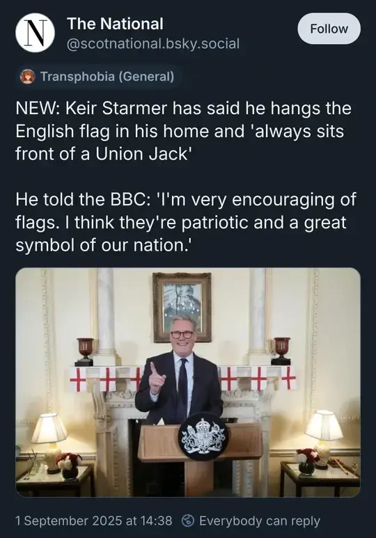 Screenshot of a post by The National with a picture of Keir Starmer smiling in front bunting of the English flag. The text reads: "NEW: Keir Starmer has said he hangs the English flag in his home and 'always sits front of a Union Jack'  He told the BBC: 'I'm very encouraging of flags. I think they're patriotic and a great symbol of our nation.'"