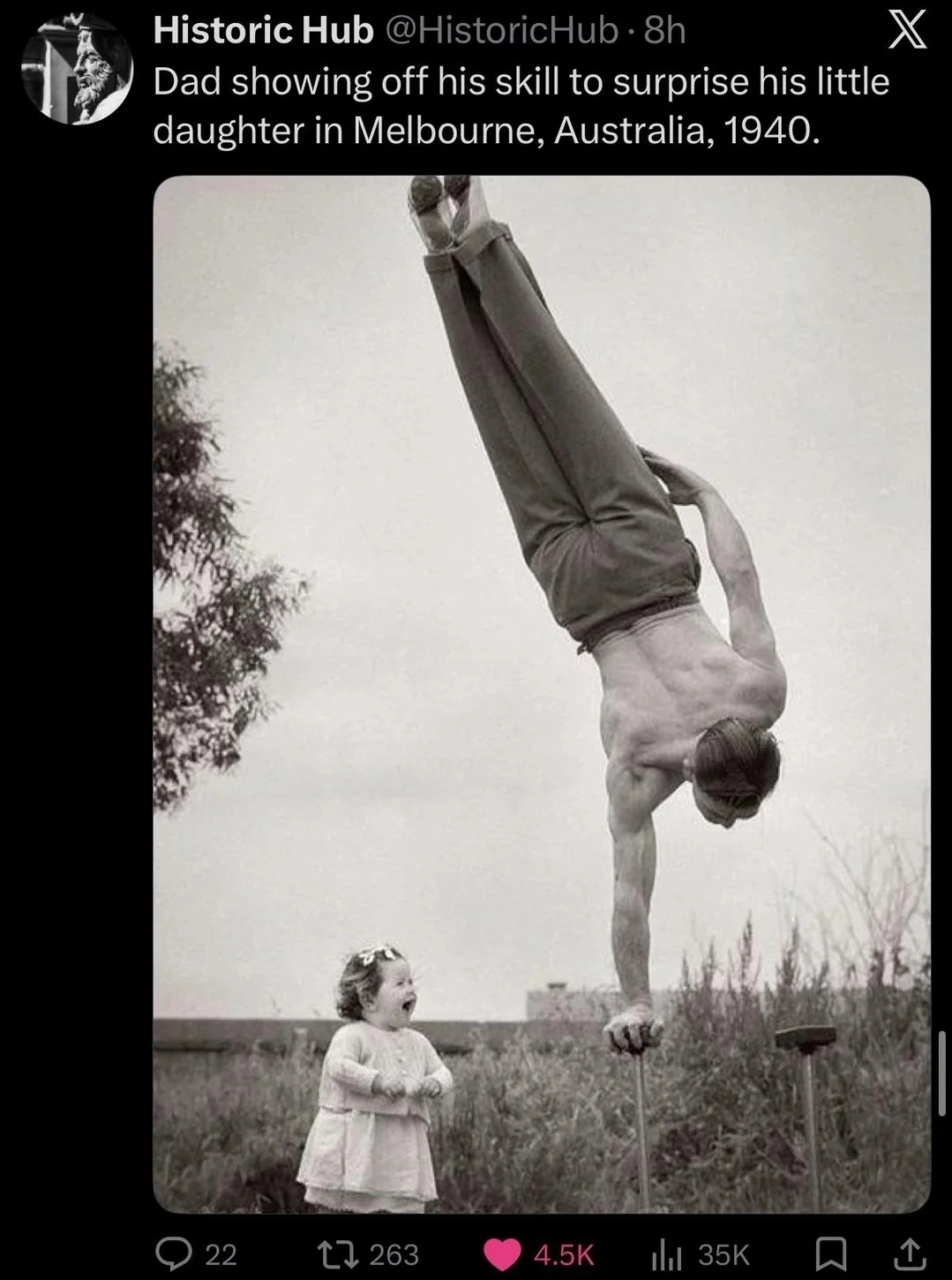 Man doing a one-arm handstand next to a little girl screaming in delight. Caption reads: "Dad showing of his skill to surprise his little daughter in Melbourne, Australia, 1940."