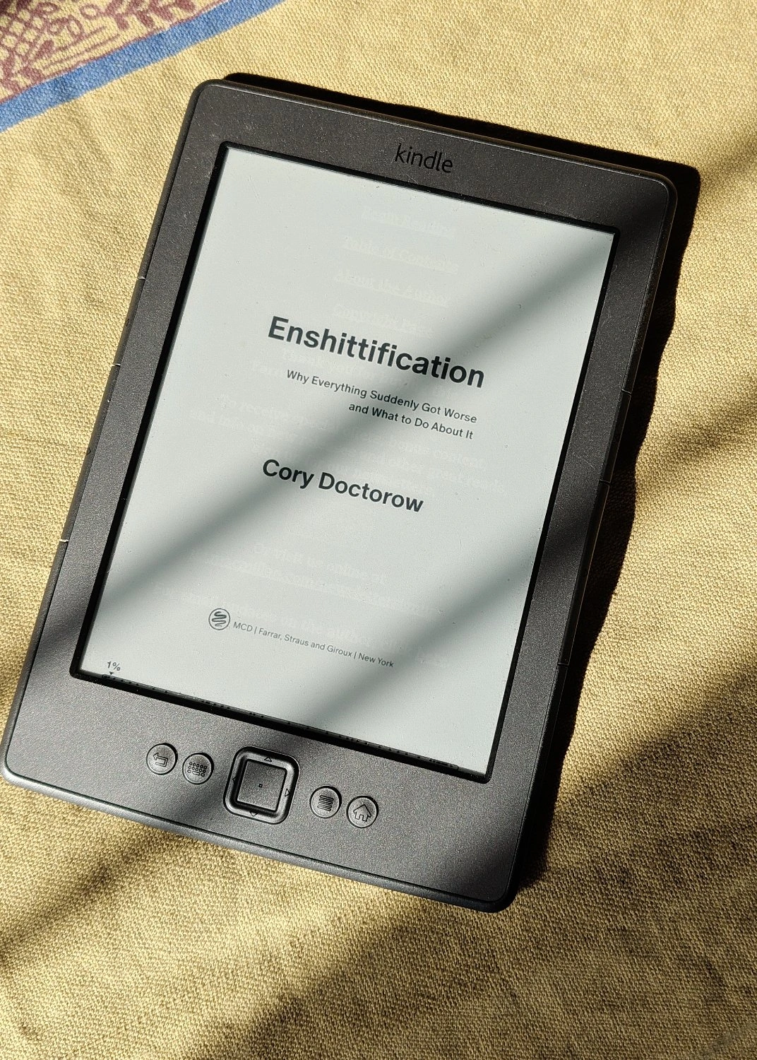  A kindle showing Enshittification book. 