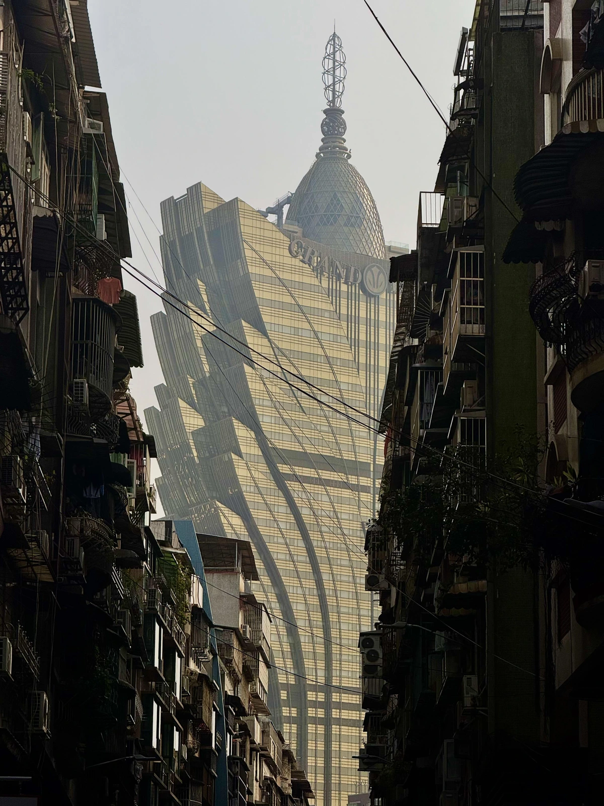 The juxtaposition of Macau’s grand lisboa casino and the residential neighborhoods nearby.