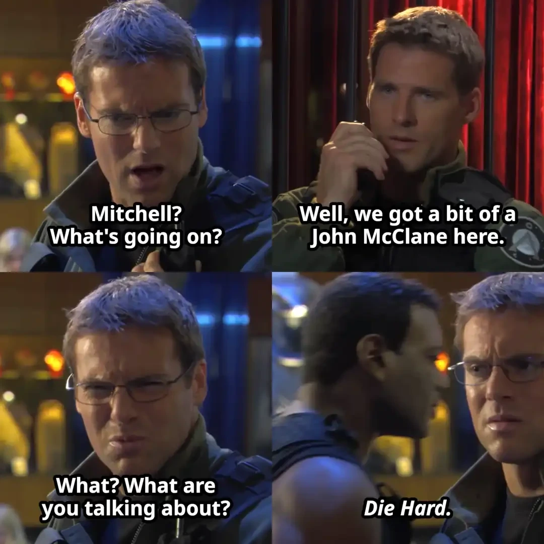 Panel 1: Daniel saying "Mitchell? What's going on?" Panel 2: Cameron saying "Well, we got a bit of a John McClane here." Panel 3: Daniel saying "What? What are you talking about?" Panel 4: Teal'c walking by in the background and saying "Die Hard."