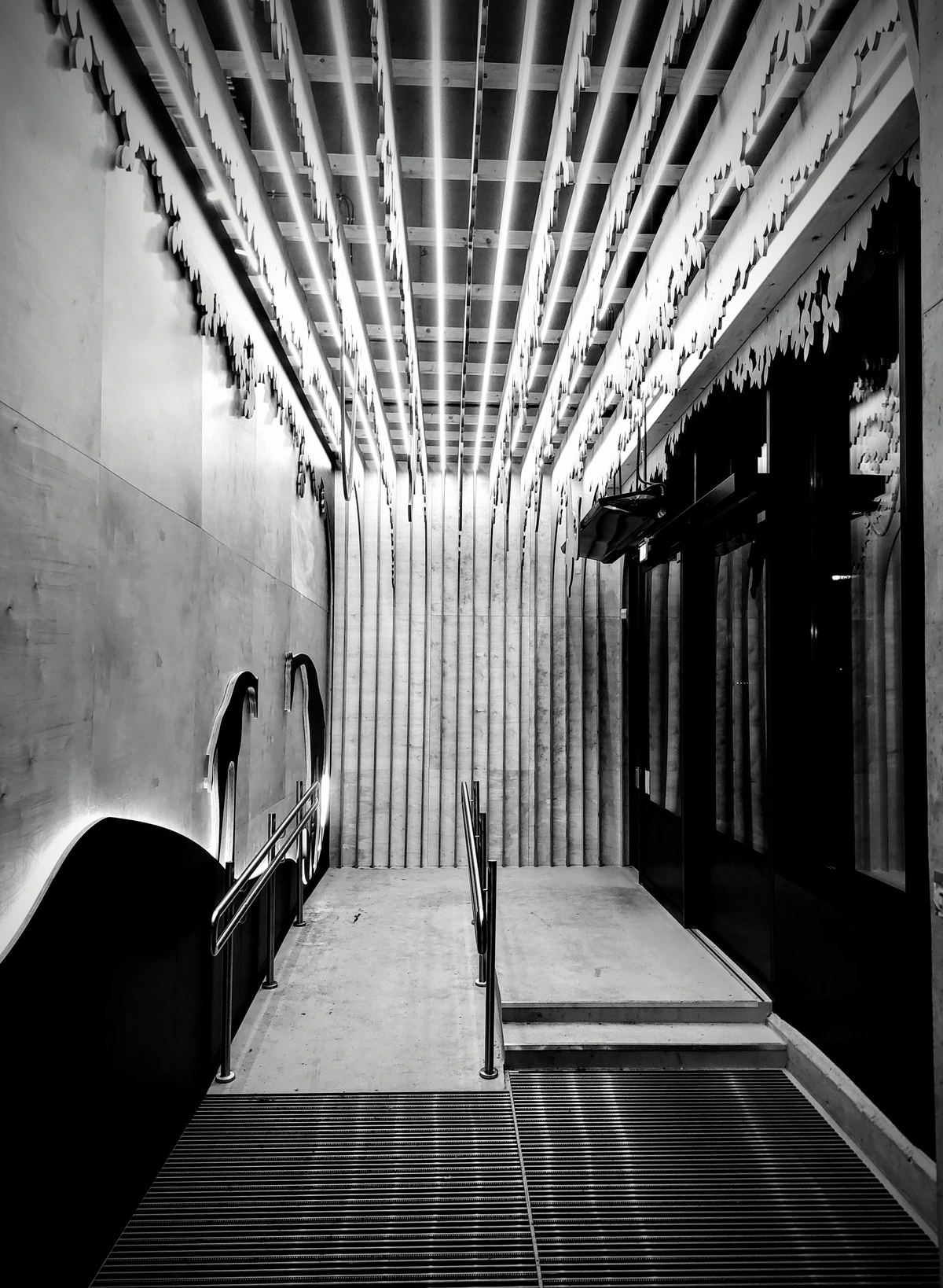 entrance/exit of venue, kept in wood and concrete
