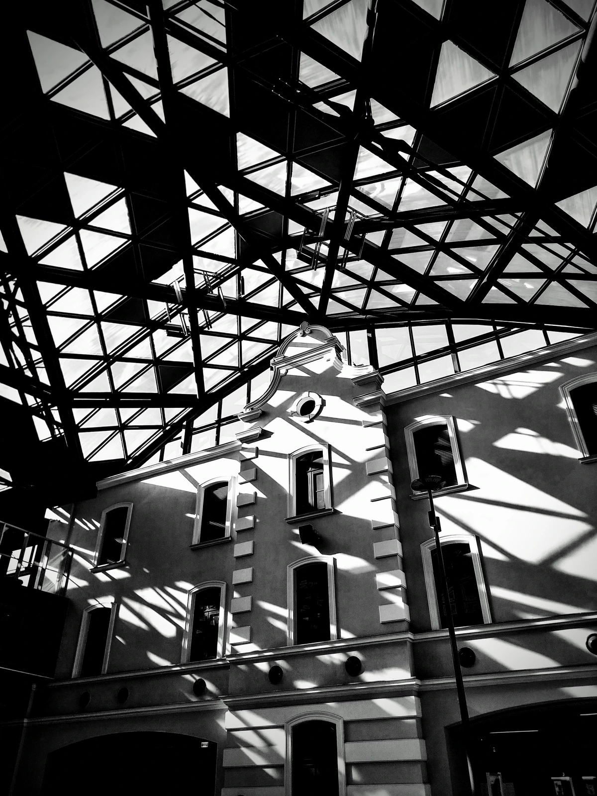 shadows of geodesic roof on foundation era house front